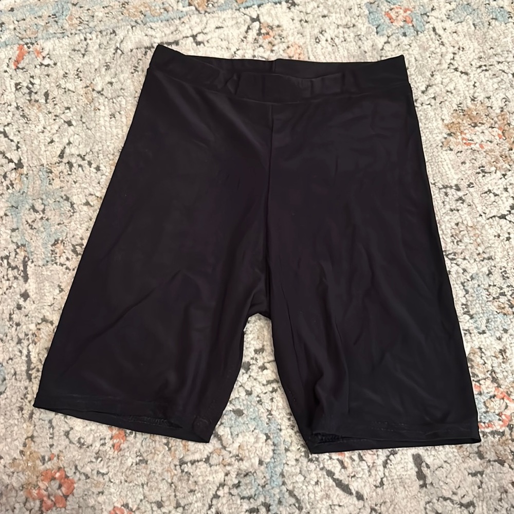 Shiny black bike shorts